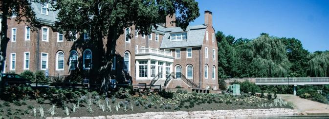 Structurally impressive building amongst trees