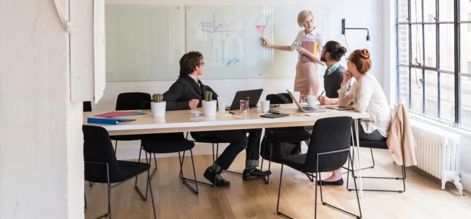 People at a desk working on sustainable finance