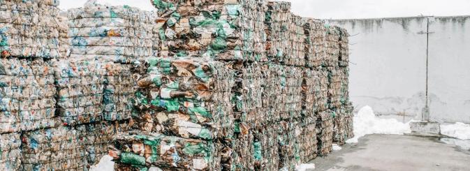 Waste management shown with paper recycling bundles